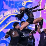 Equipo de porrismo ejecuta una elevación en una imagen promocional del Invitacional de Campeones.